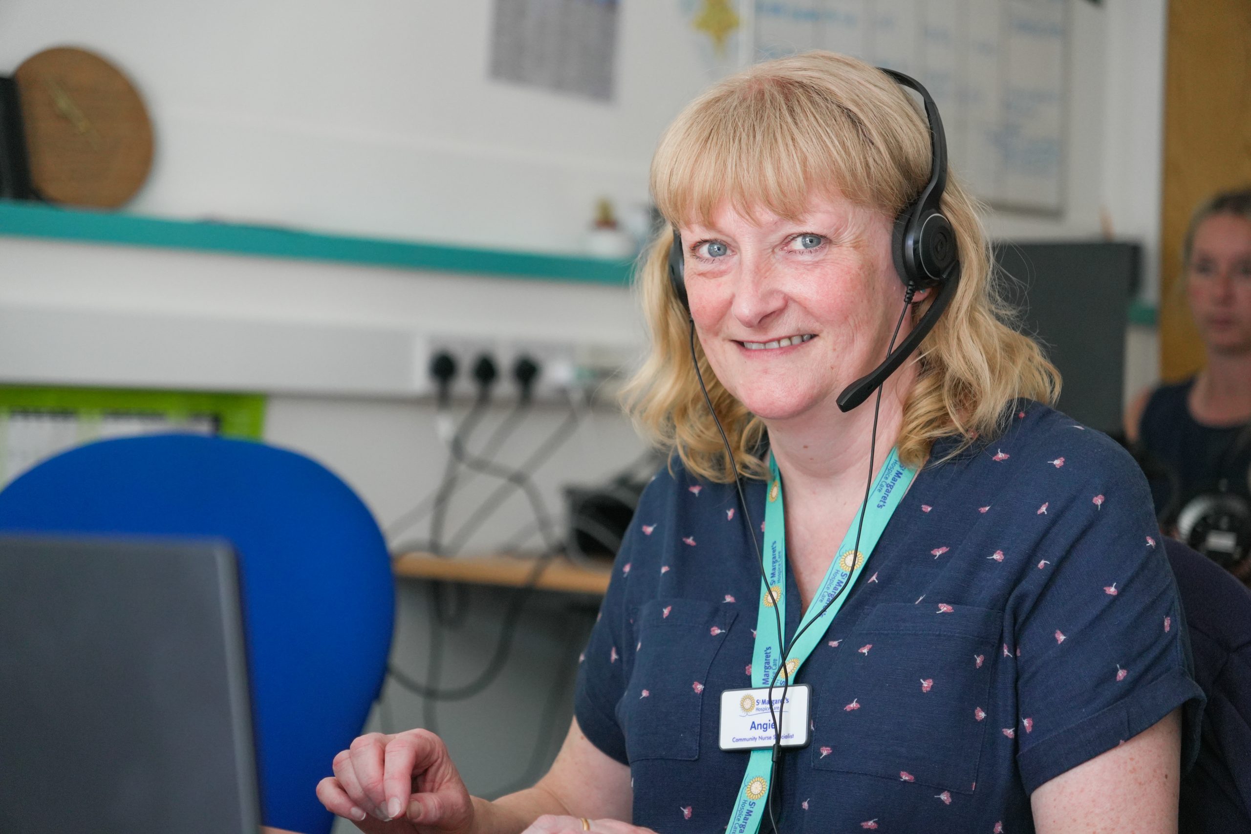 Female with a headset on taking calls