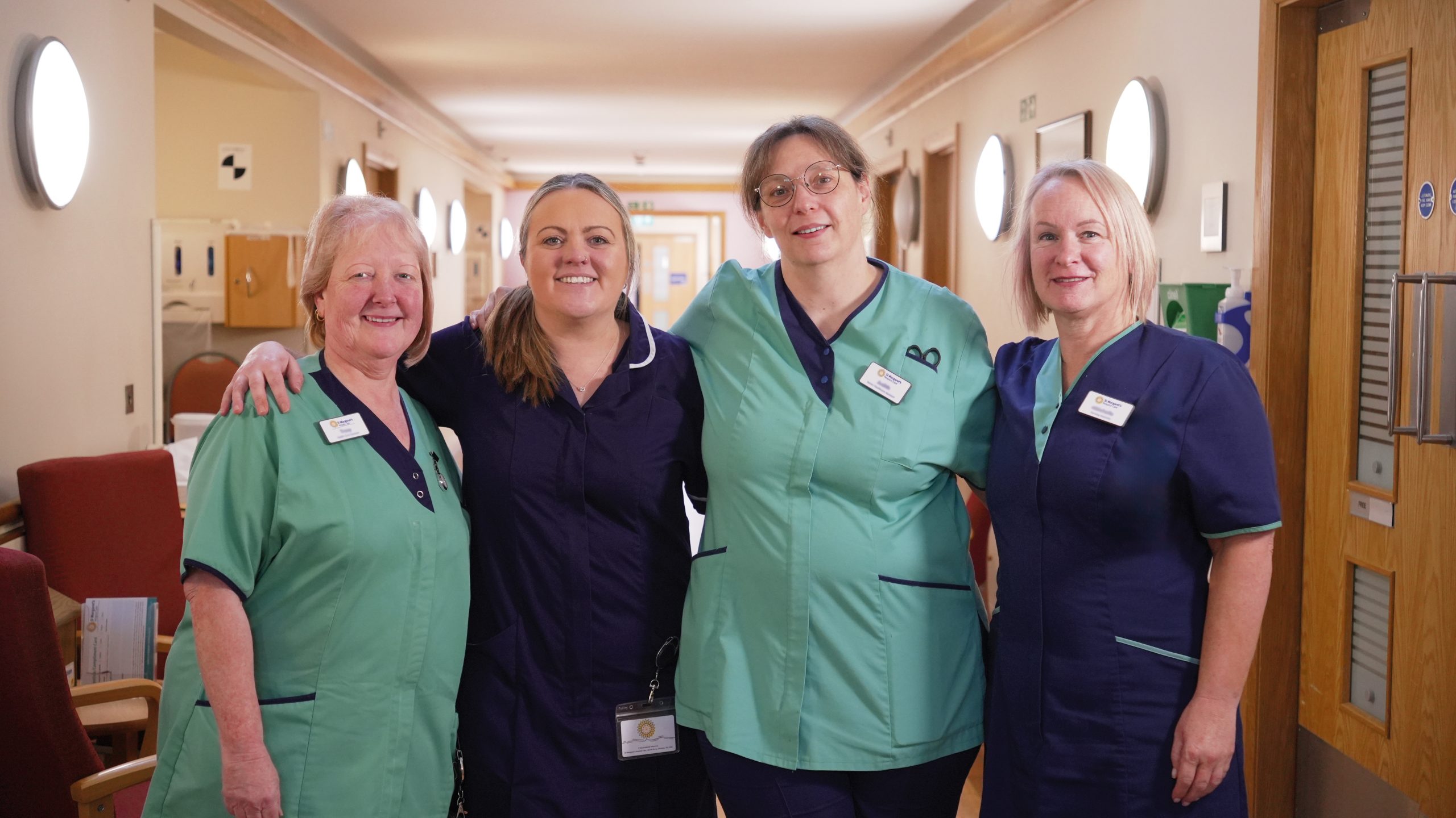 four clinicians stand together smiling