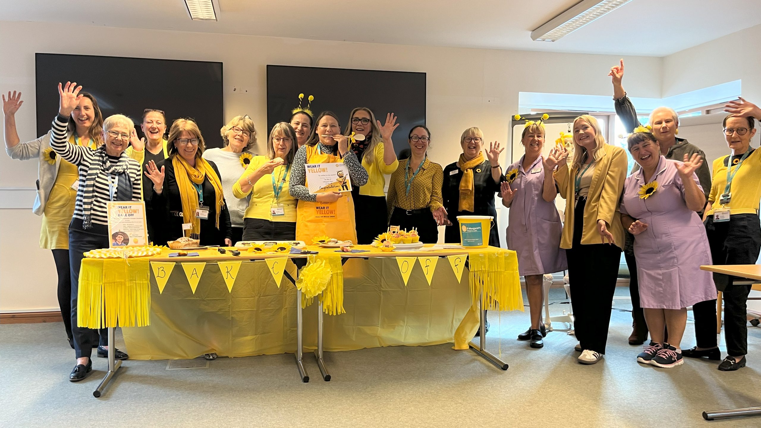 Group of people all wearing yellow at a fundraising event