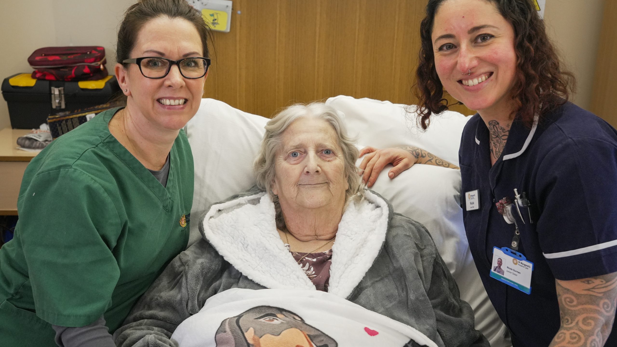 two female clinicians with a female patient in IPU