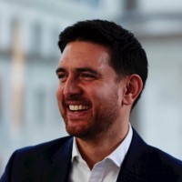 James Don Carolis - male smiling to side of camera