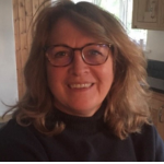 Female smiling to camera in home setting