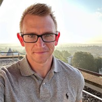 Triston Greenhow - Trustee - male outdoors, smiling at camera