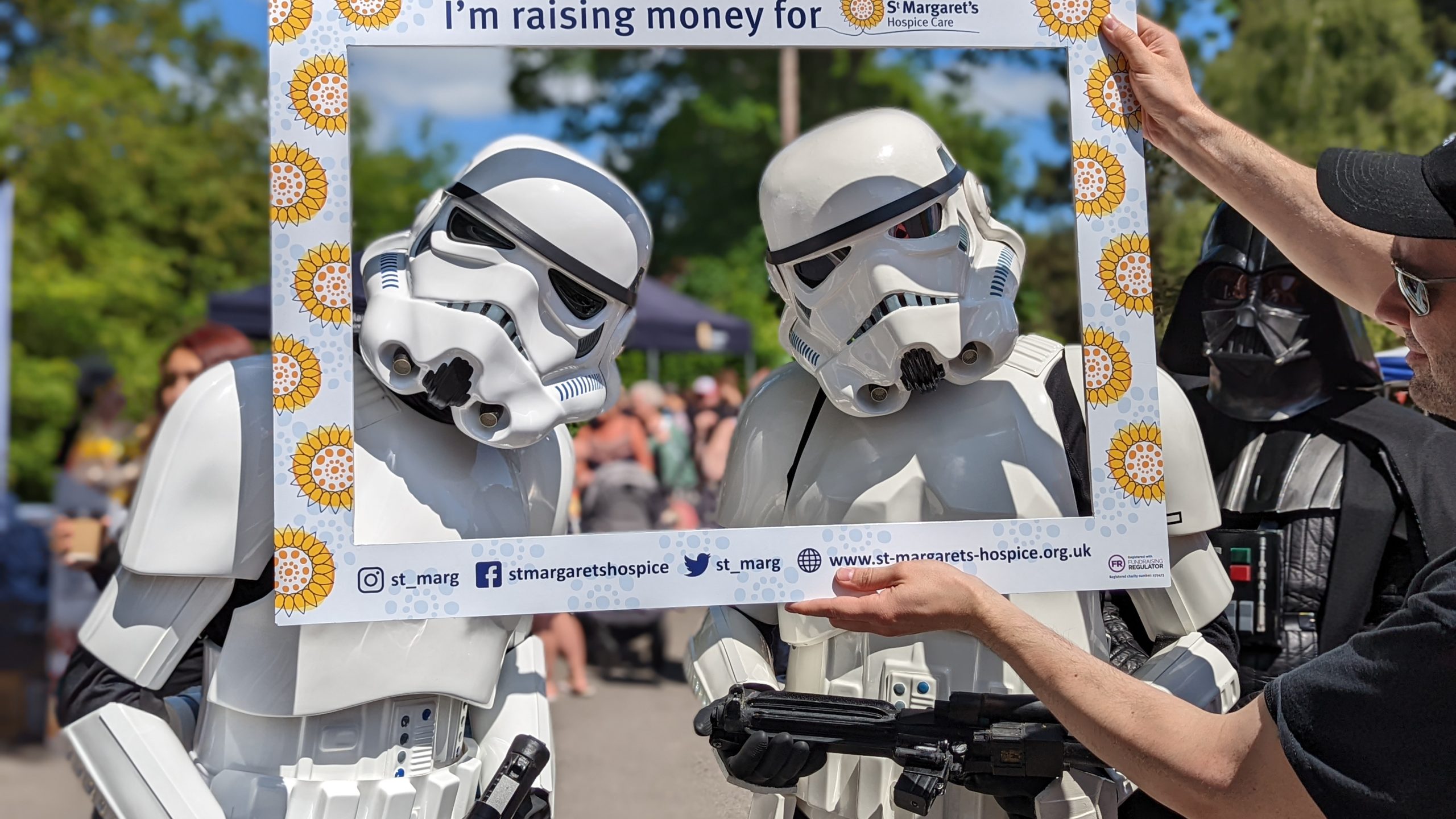 Star wars characters pose in-front of a selfie frame